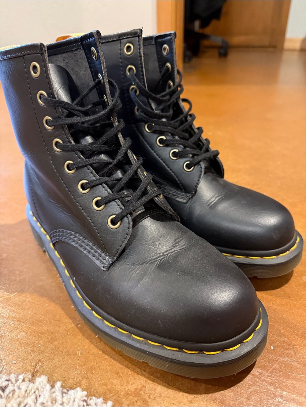 Dr. Martens Black Leather Boots with Yellow Pull-Tab and Stitching